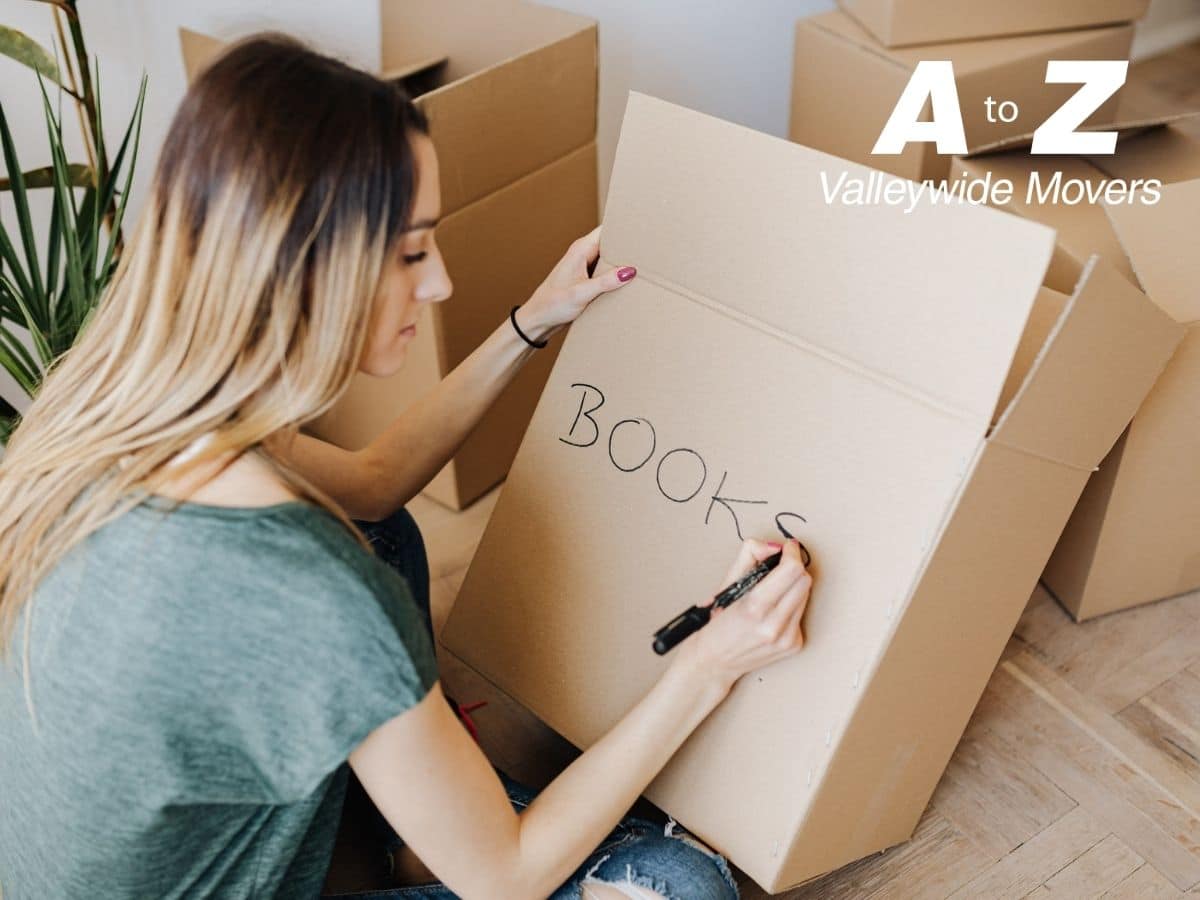 woman making a moving using different boxes