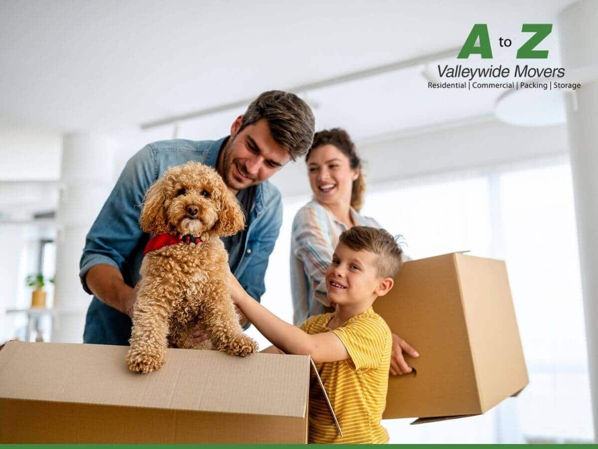 Happy Family with a their dog during moving day